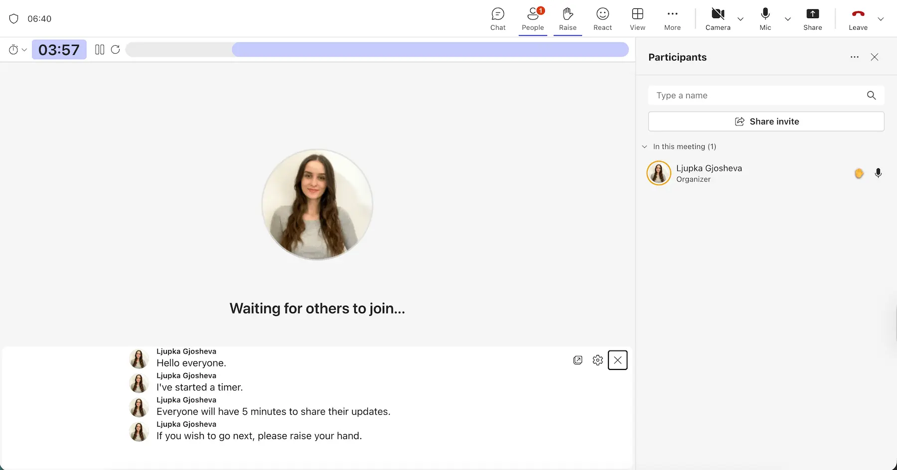 Captions, timer, and hand raise in a Teams meeting